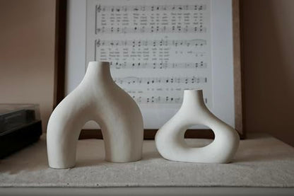 Carrot's Den Ceramic Modern Vase Set of 2, Donut Shelf Decor, Warm White | Matte pair for bookshelf and bookcase decor, mantel styling, or home staging. Holds dried stems and faux plants indoor.