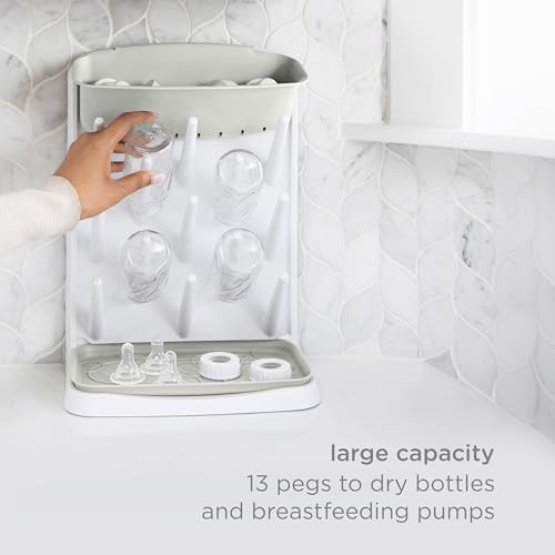 Ubbi Vertical Baby Bottle Drying Rack, Space Saving Countertop Bottle Dryer | 13-Peg Bottle Drying Rack Removable Drain Tray, Baby Organizer for Pump Parts, Pacifiers & Accessories, Dishwasher Safe, Oat