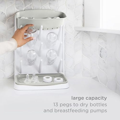 Ubbi Vertical Baby Bottle Drying Rack, Space Saving Countertop Bottle Dryer | 13-Peg Bottle Drying Rack Removable Drain Tray, Baby Organizer for Pump Parts, Pacifiers & Accessories, Dishwasher Safe, Oat